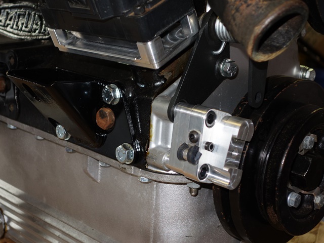 The sensor bracket is mounted using two of the bolt holes on the timing cover. The end of the bracket is adjustable, allowing movement to vary the air gap to the trigger wheel